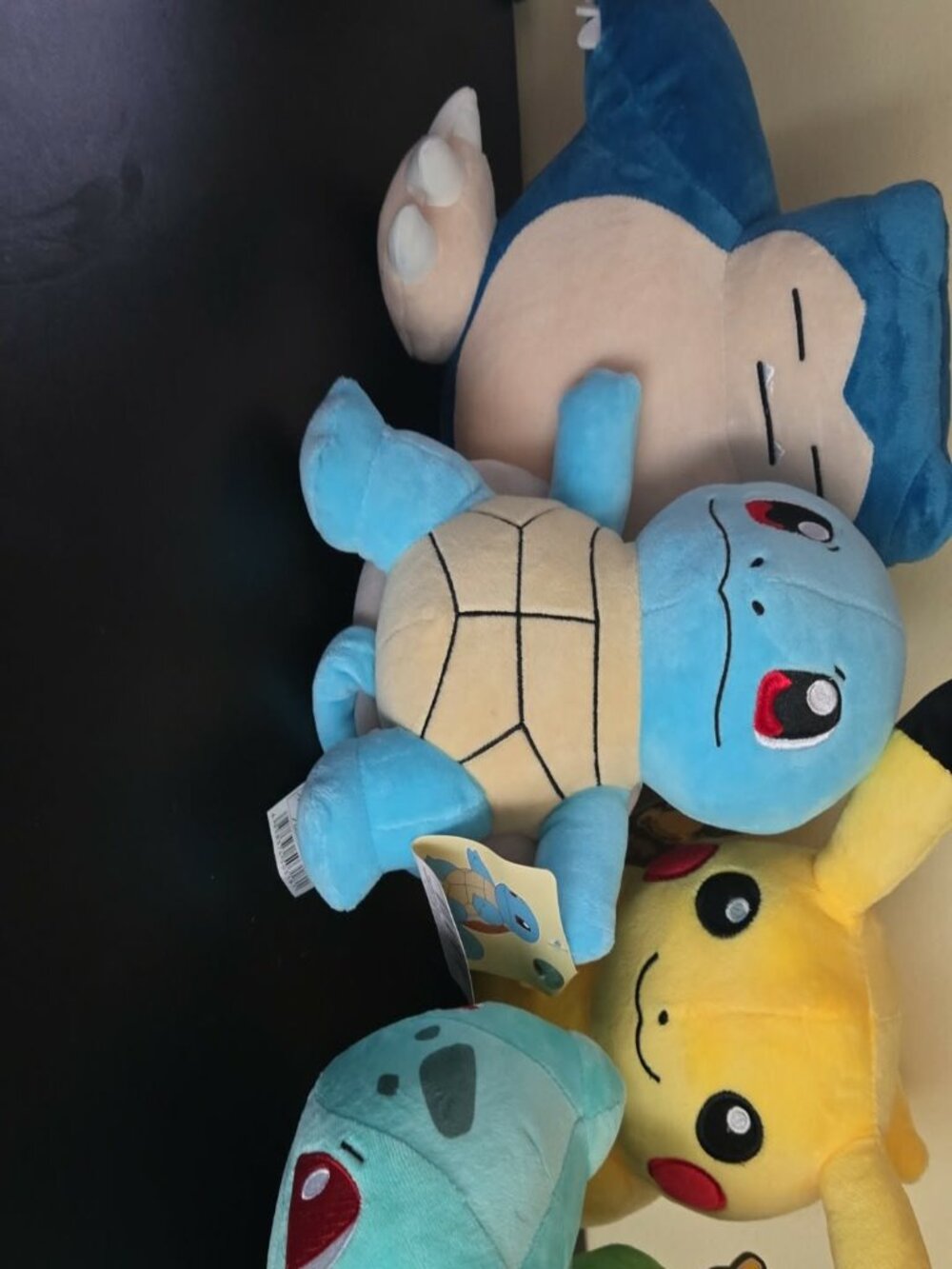 NWT 8in Snorlax, NWT 8in Squirtle, 8in Pikachu, and 8in Bulbasaur.